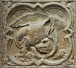 Panel 12:04 - Cockatrice-type monster with its tail disappearing into its ear